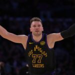 Los Angeles Lakers guard Luka Doncic (77) reacts after a 3-point basket in the second half against the Memphis Grizzlies at Crypto.com Arena.