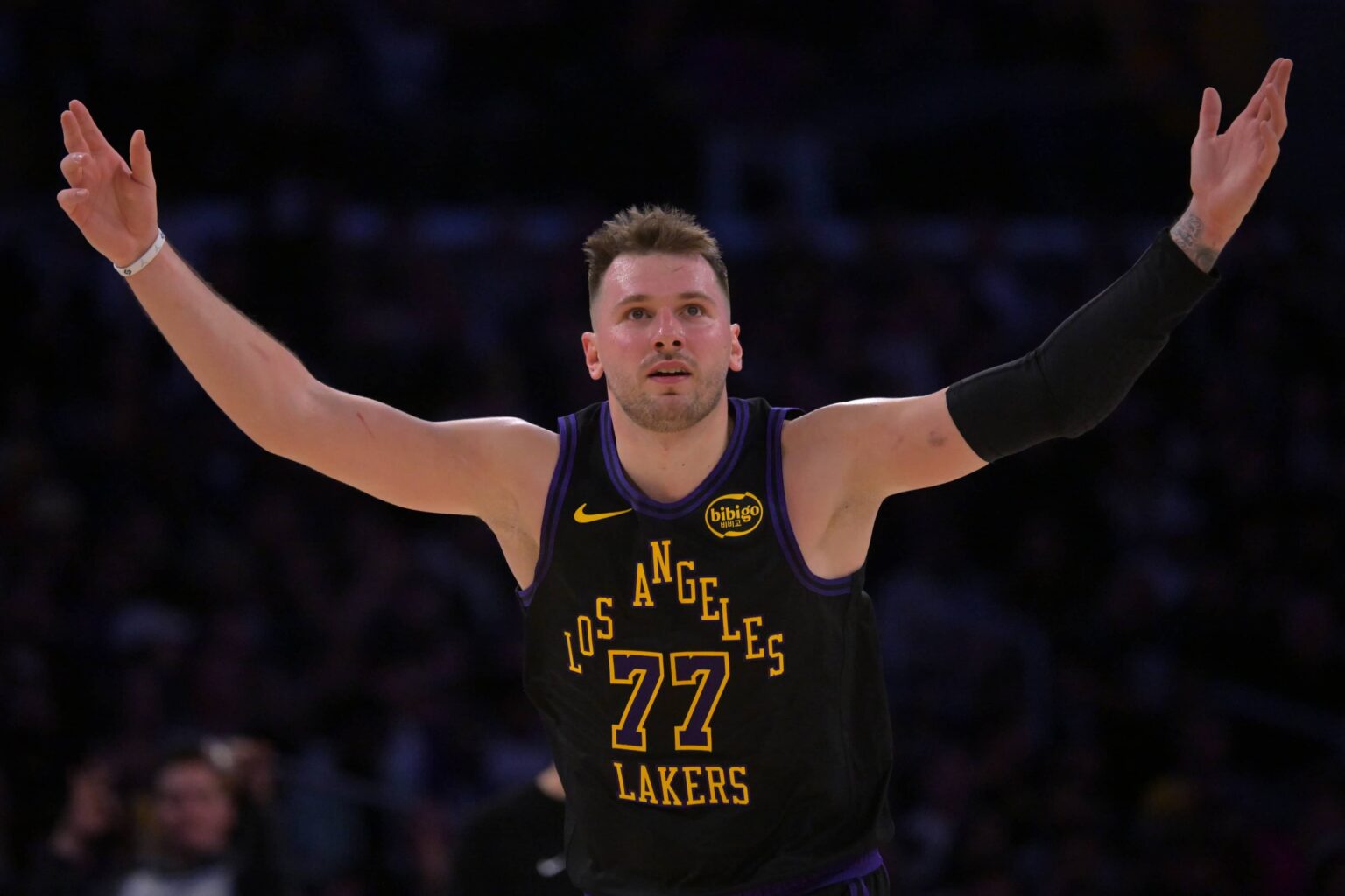 Los Angeles Lakers guard Luka Doncic (77) reacts after a 3-point basket in the second half against the Memphis Grizzlies at Crypto.com Arena.
