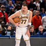 Jan 24, 2026; Dallas, Texas, USA; Los Angeles Lakers guard Luka Doncic (77) holds on to the ball at the end of the game against the Dallas Mavericks at the American Airlines Center. Mandatory Credit: Jerome Miron-Imagn Images
