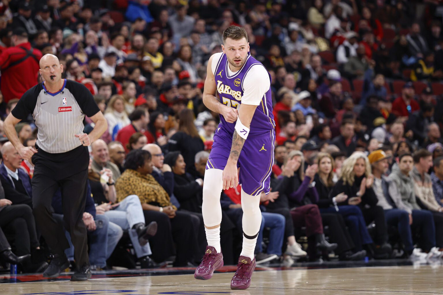 Jan 26, 2026; Chicago, Illinois, USA; Los Angeles Lakers guard Luka Doncic (77) shoots against Chicago Bulls guard Ayo Dosunmu (11) during the second half at United Center. Mandatory Credit: Kamil Krzaczynski-Imagn Images