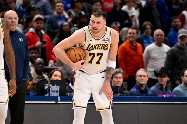 Jan 24, 2026; Dallas, Texas, USA; Los Angeles Lakers guard Luka Doncic (77) holds on to the ball at the end of the game against the Dallas Mavericks at the American Airlines Center. Mandatory Credit: Jerome Miron-Imagn Images