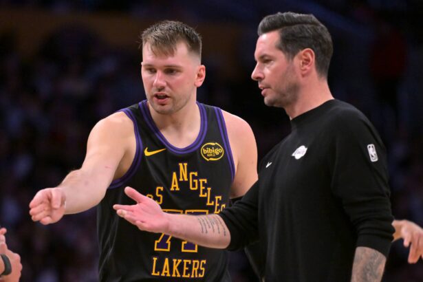 Jan 2, 2026; Los Angeles, California, USA; Los Angeles Lakers guard Luka Doncic (77) talks with head coach JJ Redick during a time out in the second half against the Memphis Grizzlies at Crypto.com Arena. Mandatory Credit: Jayne Kamin-Oncea-Imagn Images