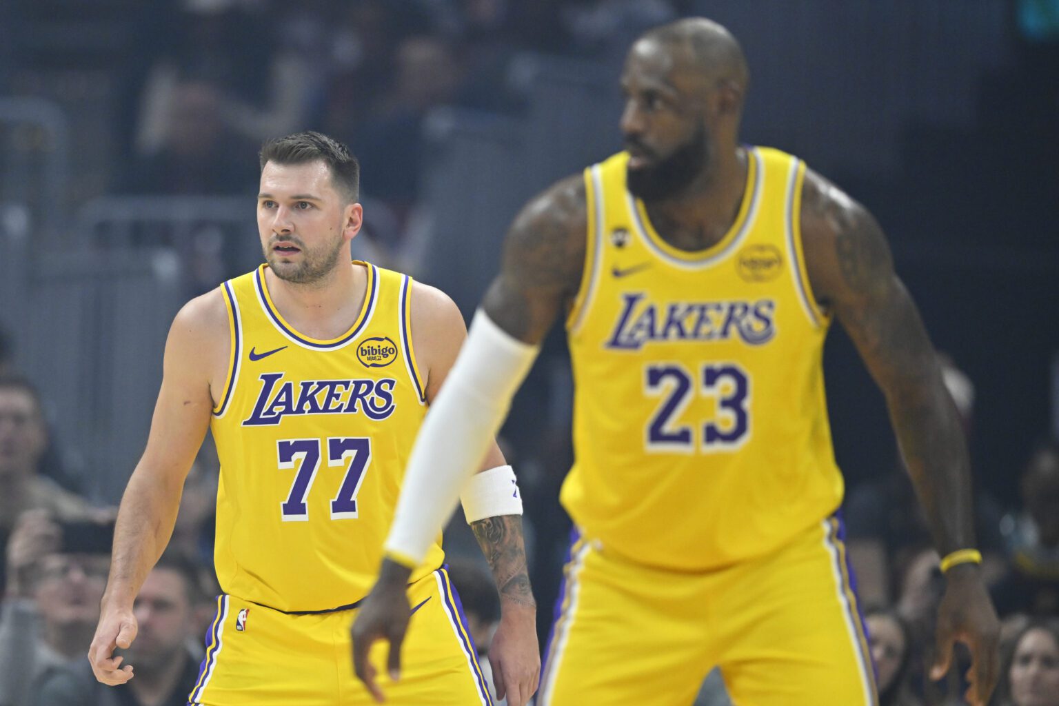 Jan 28, 2026; Cleveland, Ohio, USA; Los Angeles Lakers guard Luka Doncic (77) and forward LeBron James (23) stand on the court in the first quarter against the Cleveland Cavaliers at Rocket Arena. Mandatory Credit: David Richard-Imagn Images