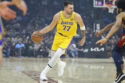 Jan 28, 2026; Cleveland, Ohio, USA; Los Angeles Lakers guard Luka Doncic (77) dribbles the ball in the first quarter against the Cleveland Cavaliers at Rocket Arena. Mandatory Credit: David Richard-Imagn Images