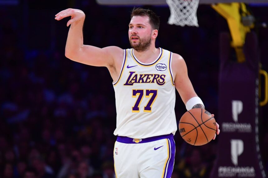 Jan 18, 2026; Los Angeles, California, USA; Los Angeles Lakers guard Luka Doncic (77) moves the ball down court against the Toronto Raptors during the first half at Crypto.com Arena. Mandatory Credit: Gary A. Vasquez-Imagn Images