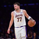 Nov 30, 2025; Los Angeles, California, USA; Los Angeles Lakers guard Luka Doncic (77) controls the ball against the New Orleans Pelicans during the first half at Crypto.com Arena. Mandatory Credit: Gary A. Vasquez-Imagn Images