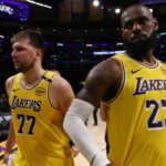 Apr 22, 2025; Los Angeles, California, USA; Los Angeles Lakers guard Luka Doncic (77) and Los Angeles Lakers forward LeBron James (23) leave a court after defeating the Minnesota Timberwolves 94-85 in game two of first round for the 2024 NBA Playoffs at Crypto.com Arena. Mandatory Credit: Kiyoshi Mio-Imagn Images