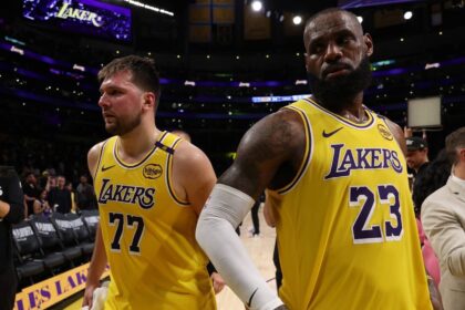 Apr 22, 2025; Los Angeles, California, USA; Los Angeles Lakers guard Luka Doncic (77) and Los Angeles Lakers forward LeBron James (23) leave a court after defeating the Minnesota Timberwolves 94-85 in game two of first round for the 2024 NBA Playoffs at Crypto.com Arena. Mandatory Credit: Kiyoshi Mio-Imagn Images