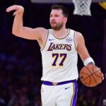 Jan 18, 2026; Los Angeles, California, USA; Los Angeles Lakers guard Luka Doncic (77) moves the ball down court against the Toronto Raptors during the first half at Crypto.com Arena. Mandatory Credit: Gary A. Vasquez-Imagn Images