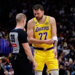 Jan 20, 2026; Denver, Colorado, USA; Los Angeles Lakers guard Luka Doncic (77) talks with referee Tyler Ford (39) in the first quarter against the Denver Nuggets at Ball Arena. Mandatory Credit: Isaiah J. Downing-Imagn Images