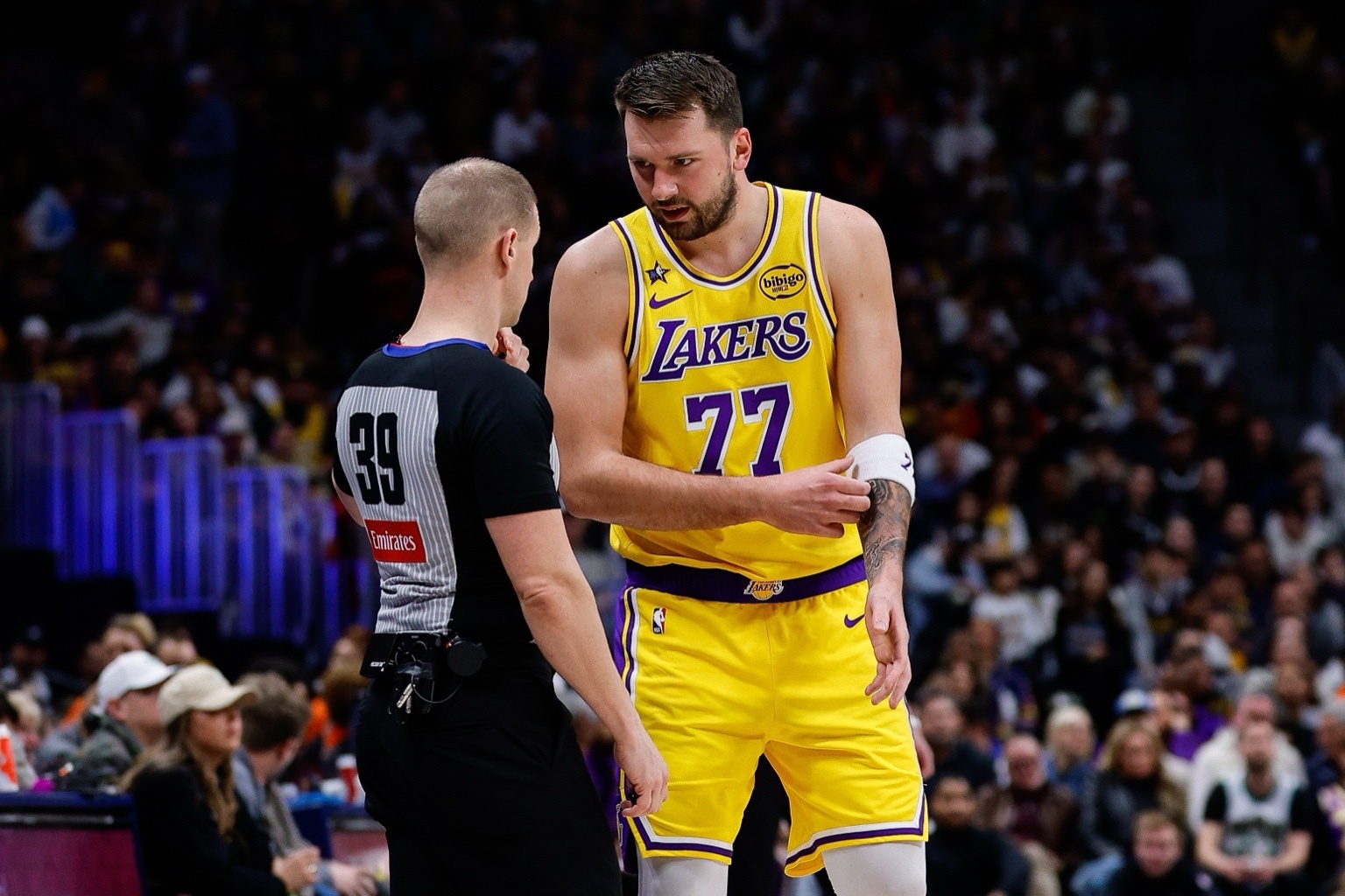 Jan 20, 2026; Denver, Colorado, USA; Los Angeles Lakers guard Luka Doncic (77) talks with referee Tyler Ford (39) in the first quarter against the Denver Nuggets at Ball Arena. Mandatory Credit: Isaiah J. Downing-Imagn Images