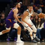 Jan 27, 2026; Phoenix, Arizona, USA; Brooklyn Nets forward Michael Porter Jr. (17) against Phoenix Suns forward Dillon Brooks (3) in the first half at Mortgage Matchup Center. Mandatory Credit: Mark J. Rebilas-Imagn Images