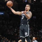 Jan 4, 2026; Brooklyn, New York, USA; Brooklyn Nets forward Michael Porter Jr. (17) grabs a rebound in the second quarter against the Denver Nuggets at Barclays Center. Mandatory Credit: Wendell Cruz-Imagn Images