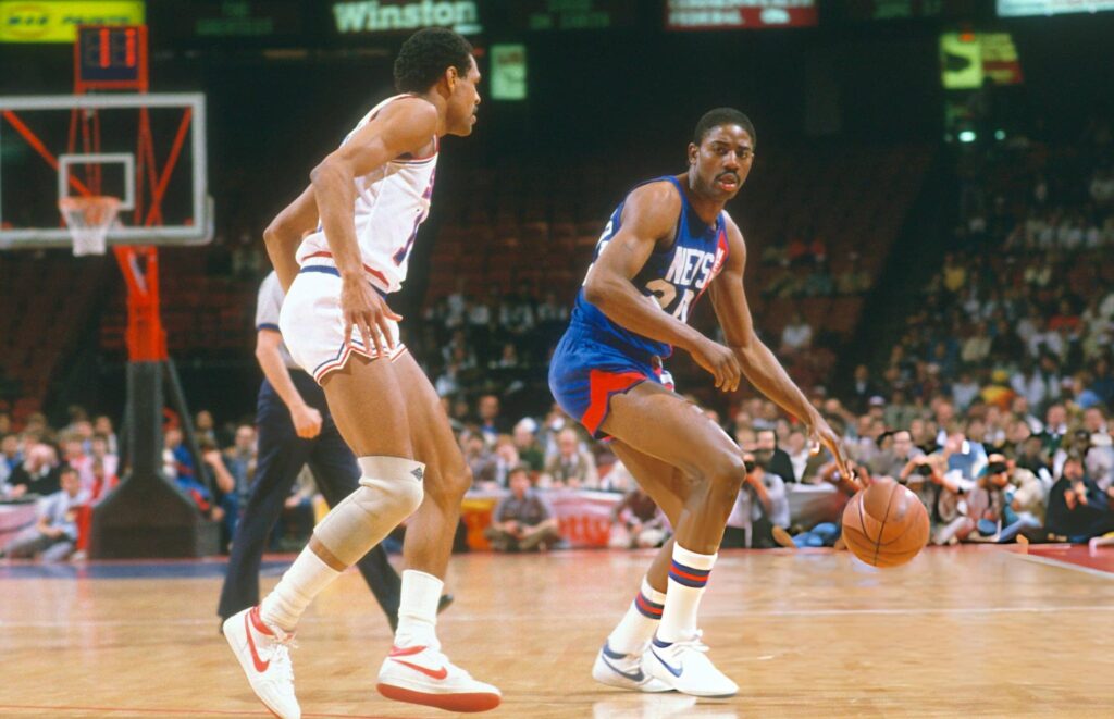 PHILADELPHIA, PA - CIRCA 1984: Michael Ray Richardson #20 of the New Jersey Nets looks to put a move on Maurice Cheeks #10 of the Philadelphia 76ers during an NBA basketball game circa 1984 at The Spectrum in Philadelphia, Pennsylvania. Richardson played for the Nets from 1982-86. (Photo by Focus on Sport/Getty Images)