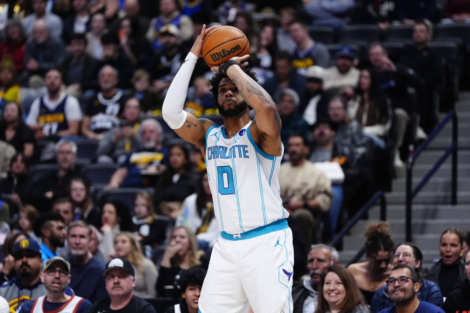 Jan 18, 2026; Denver, Colorado, USA; Charlotte Hornets forward Miles Bridges (0) shoots in the first quarter against the Denver Nuggets at Ball Arena. Mandatory Credit: Ron Chenoy-Imagn Images