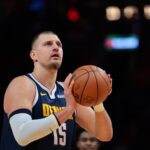 Dec 29, 2025; Miami, Florida, USA; Denver Nuggets center Nikola Jokic (15) shoots a free throw against the Miami Heat during the first quarter at Kaseya Center. Mandatory Credit: Sam Navarro-Imagn Images