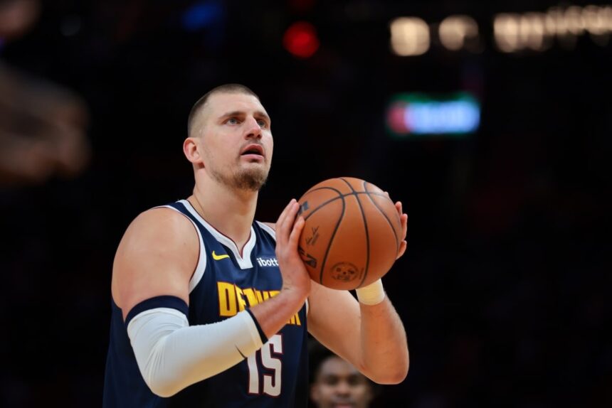 Dec 29, 2025; Miami, Florida, USA; Denver Nuggets center Nikola Jokic (15) shoots a free throw against the Miami Heat during the first quarter at Kaseya Center. Mandatory Credit: Sam Navarro-Imagn Images