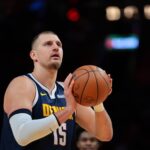 Dec 29, 2025; Miami, Florida, USA; Denver Nuggets center Nikola Jokic (15) shoots a free throw against the Miami Heat during the first quarter at Kaseya Center. Mandatory Credit: Sam Navarro-Imagn Images