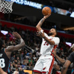 Jan 1, 2026; Detroit, Michigan, USA; Miami Heat guard Norman Powell (24) shoots the ball over Detroit Pistons forward Isaiah Stewart (28) in the third quarter at Little Caesars Arena. Mandatory Credit: Lon Horwedel-Imagn Images