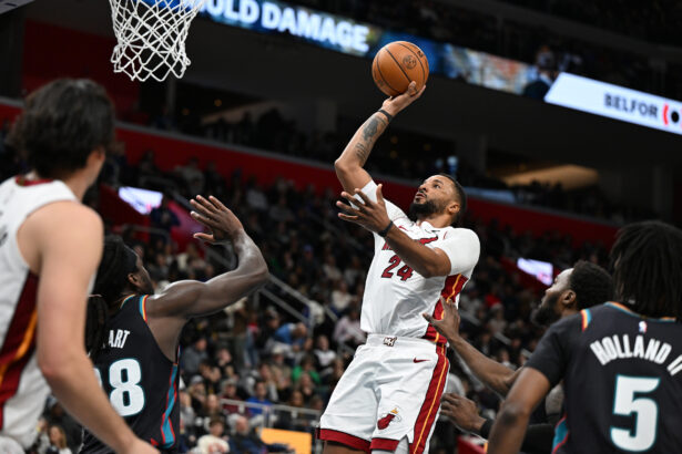 Jan 1, 2026; Detroit, Michigan, USA; Miami Heat guard Norman Powell (24) shoots the ball over Detroit Pistons forward Isaiah Stewart (28) in the third quarter at Little Caesars Arena. Mandatory Credit: Lon Horwedel-Imagn Images