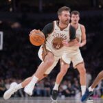 Jan 26, 2026; Minneapolis, Minnesota, USA; Golden State Warriors guard Pat Spencer (61) dribbles against the Minnesota Timberwolves in the second quarter at Target Center. Mandatory Credit: Brad Rempel-Imagn Images