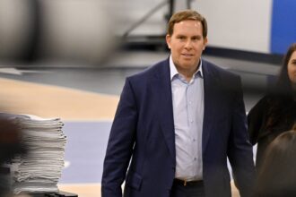 Dallas Mavericks governor Patrick Dumont arrives at a press conference at the Dallas Mavericks Practice Facility.