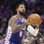 Philadelphia 76ers forward Paul George (8) shoots the ball against the Milwaukee Bucks during the third quarter at Xfinity Mobile Arena.