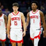 Dec 21, 2025; Sacramento, California, USA; Houston Rockets guard Reed Sheppard (15) and guard Amen Thompson (1) walk off the court for a time out during the fourth quarter against the Sacramento Kings at Golden 1 Center. Mandatory Credit: Sergio Estrada-Imagn Images