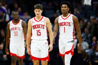 Dec 21, 2025; Sacramento, California, USA; Houston Rockets guard Reed Sheppard (15) and guard Amen Thompson (1) walk off the court for a time out during the fourth quarter against the Sacramento Kings at Golden 1 Center. Mandatory Credit: Sergio Estrada-Imagn Images