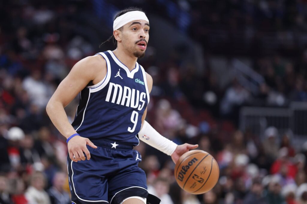 Jan 10, 2026; Chicago, Illinois, USA; Dallas Mavericks guard Ryan Nembhard (9) brings the ball up court against the Chicago Bulls during the second half at United Center. Mandatory Credit: Kamil Krzaczynski-Imagn Images