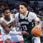Dec 23, 2025; Indianapolis, Indiana, USA; Milwaukee Bucks guard Ryan Rollins (13) dribbles the ball while Indiana Pacers guard/forward Bennedict Mathurin (00) defends in the second half at Gainbridge Fieldhouse. Mandatory Credit: Trevor Ruszkowski-Imagn Images
