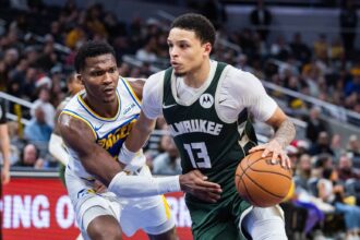 Dec 23, 2025; Indianapolis, Indiana, USA; Milwaukee Bucks guard Ryan Rollins (13) dribbles the ball while Indiana Pacers guard/forward Bennedict Mathurin (00) defends in the second half at Gainbridge Fieldhouse. Mandatory Credit: Trevor Ruszkowski-Imagn Images