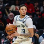 Jan 19, 2026; Atlanta, Georgia, USA; Milwaukee Bucks guard Ryan Rollins (13) looks to pass the ball against the Atlanta Hawks during the first quarter at State Farm Arena. Mandatory Credit: Jordan Godfree-Imagn Images