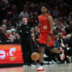 Mar 16, 2025; Portland, Oregon, USA; Portland Trail Blazers guard Scoot Henderson (00) brings the ball up the court against the Toronto Raptors in the second half at Moda Center. Mandatory Credit: Jaime Valdez-Imagn Images