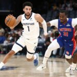 Oct 6, 2025; Memphis, Tennessee, USA; Memphis Grizzlies guard Scotty Pippen Jr. (1) dribbles around a screen set by forward Olivier-Maxence Prosper (18) on Detroit Pistons guard Javonte Green (31) during the fourth quarter at FedExForum. Mandatory Credit: Petre Thomas-Imagn Images