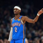 Jan 4, 2026; Phoenix, Arizona, USA; Oklahoma City Thunder guard Shai Gilgeous-Alexander (2) against the Phoenix Suns in the first half at Mortgage Matchup Center. Mandatory Credit: Mark J. Rebilas-Imagn Images