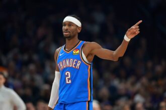 Jan 4, 2026; Phoenix, Arizona, USA; Oklahoma City Thunder guard Shai Gilgeous-Alexander (2) against the Phoenix Suns in the first half at Mortgage Matchup Center. Mandatory Credit: Mark J. Rebilas-Imagn Images