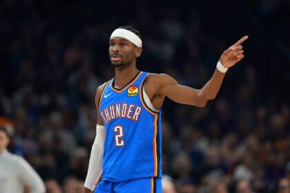 Jan 4, 2026; Phoenix, Arizona, USA; Oklahoma City Thunder guard Shai Gilgeous-Alexander (2) against the Phoenix Suns in the first half at Mortgage Matchup Center. Mandatory Credit: Mark J. Rebilas-Imagn Images