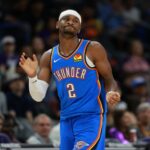 Jan 4, 2026; Phoenix, Arizona, USA; Oklahoma City Thunder guard Shai Gilgeous-Alexander (2) against the Phoenix Suns in the first half at Mortgage Matchup Center. Mandatory Credit: Mark J. Rebilas-Imagn Images