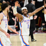 Jan 19, 2026; Cleveland, Ohio, USA; Oklahoma City Thunder guard Luguentz Dort (5) and center Chet Holmgren (7) celebrate after a three point basket during the second half against the Cleveland Cavaliers at Rocket Arena. Mandatory Credit: Ken Blaze-Imagn Images