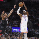 Jan 15, 2026; Houston, Texas, USA; Oklahoma City Thunder guard Shai Gilgeous-Alexander (2) shoots the ball as Houston Rockets guard JD Davison (4) defends during the third quarter at Toyota Center. Mandatory Credit: Troy Taormina-Imagn Images