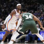 Jan 21, 2026; Milwaukee, Wisconsin, USA; Oklahoma City Thunder guard Shai Gilgeous-Alexander (2) drives against Milwaukee Bucks forward Giannis Antetokounmpo (34) in the first half at Fiserv Forum. Mandatory Credit: Michael McLoone-Imagn Images