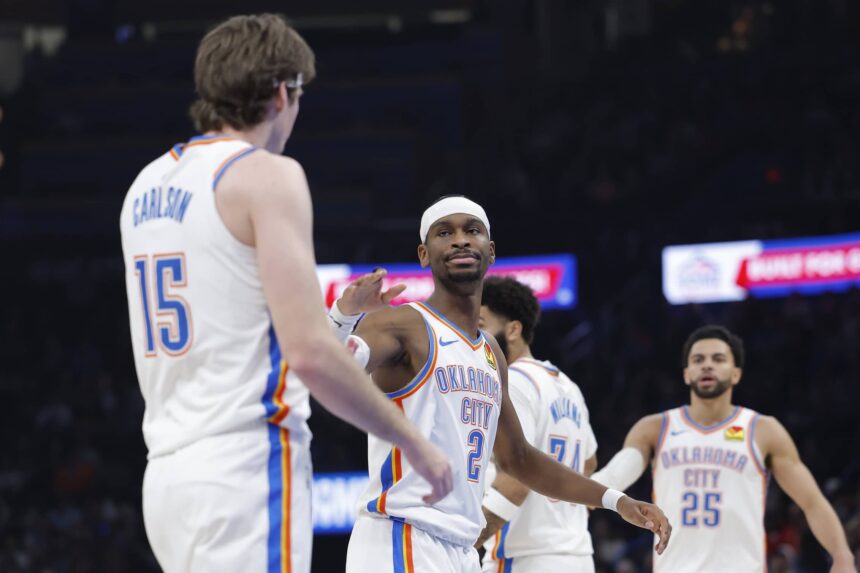 Jan 5, 2026; Oklahoma City, Oklahoma, USA; Oklahoma City Thunder guard Shai Gilgeous-Alexander (2) high fives center Branden Carlson (15) after a play against the Charlotte Hornets during the second quarter at Paycom Center. Mandatory Credit: Alonzo Adams-Imagn Images