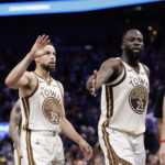 Jan 9, 2026; San Francisco, California, USA; Golden State Warriors guard Stephen Curry (30) and forward Draymond Green (23) high five guard Brandin Podziemski (2) after a play against the Sacramento Kings during the fourth quarter at Chase Center. Mandatory Credit: Kelley L Cox-Imagn Images