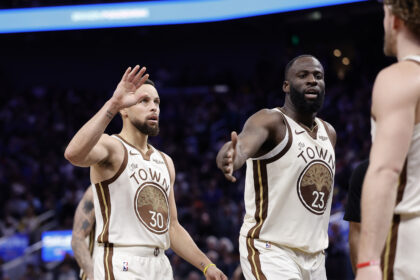 Jan 9, 2026; San Francisco, California, USA; Golden State Warriors guard Stephen Curry (30) and forward Draymond Green (23) high five guard Brandin Podziemski (2) after a play against the Sacramento Kings during the fourth quarter at Chase Center. Mandatory Credit: Kelley L Cox-Imagn Images