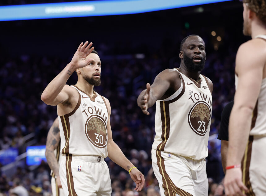 Jan 9, 2026; San Francisco, California, USA; Golden State Warriors guard Stephen Curry (30) and forward Draymond Green (23) high five guard Brandin Podziemski (2) after a play against the Sacramento Kings during the fourth quarter at Chase Center. Mandatory Credit: Kelley L Cox-Imagn Images