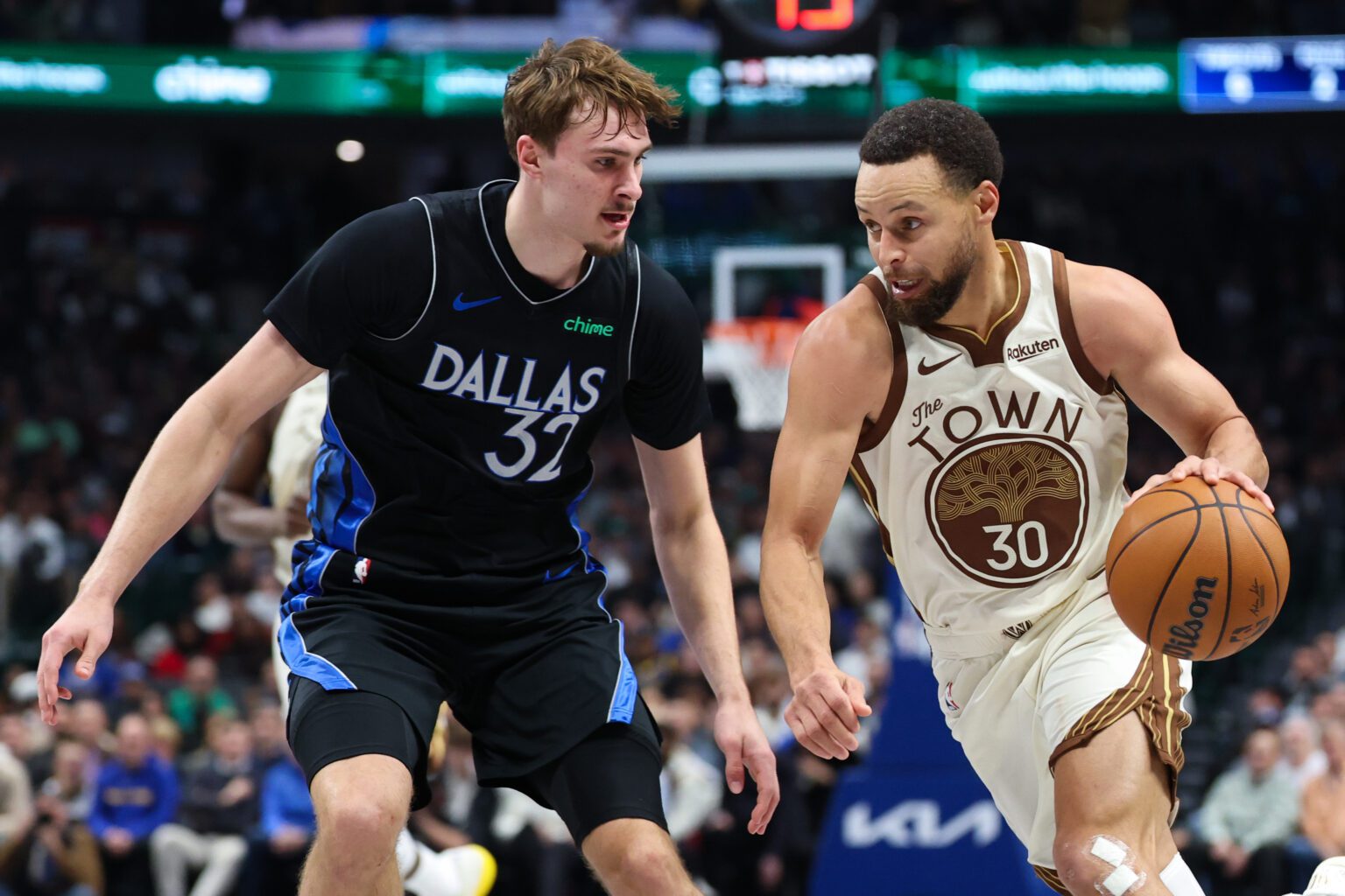 Jan 22, 2026; Dallas, Texas, USA; Golden State Warriors guard Stephen Curry (30) drives to the basket as Dallas Mavericks forward Cooper Flagg (32) defends during the first half at American Airlines Center. Mandatory Credit: Kevin Jairaj-Imagn Images