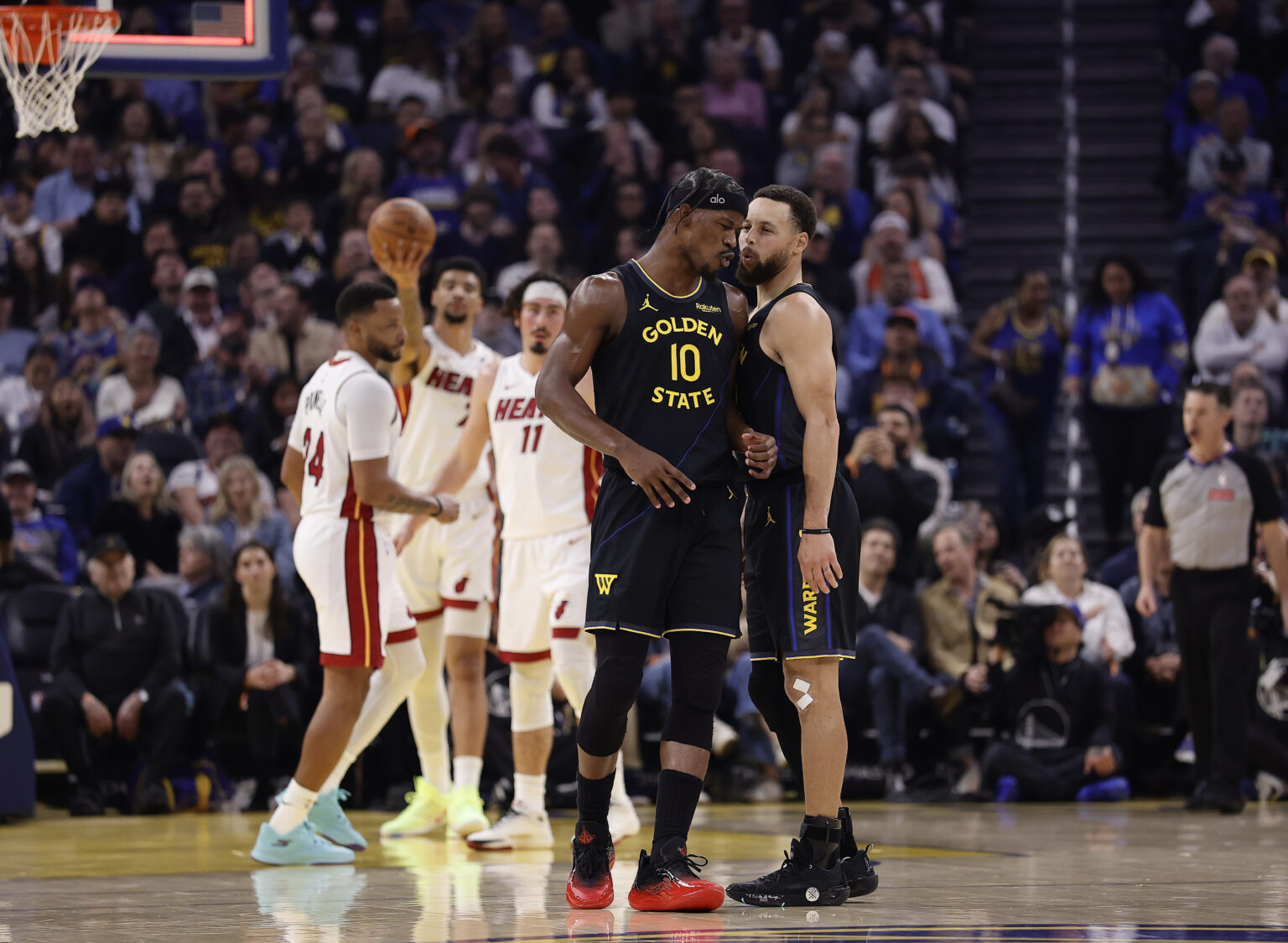 Jan 19, 2026; San Francisco, California, USA; Golden State Warriors forward Jimmy Butler III (10) and guard Stephen Curry (30) react after Butler misses a shot at the buzzer during the first quarter against the Miami Heat at Chase Center. Mandatory Credit: Kelley L Cox-Imagn Images
