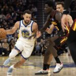 Jan 11, 2026; San Francisco, California, USA; Golden State Warriors guard Stephen Curry (30) drives around Atlanta Hawks forward Mouhamed Gueye (18) during the third quarter at Chase Center. Mandatory Credit: D. Ross Cameron-Imagn Images