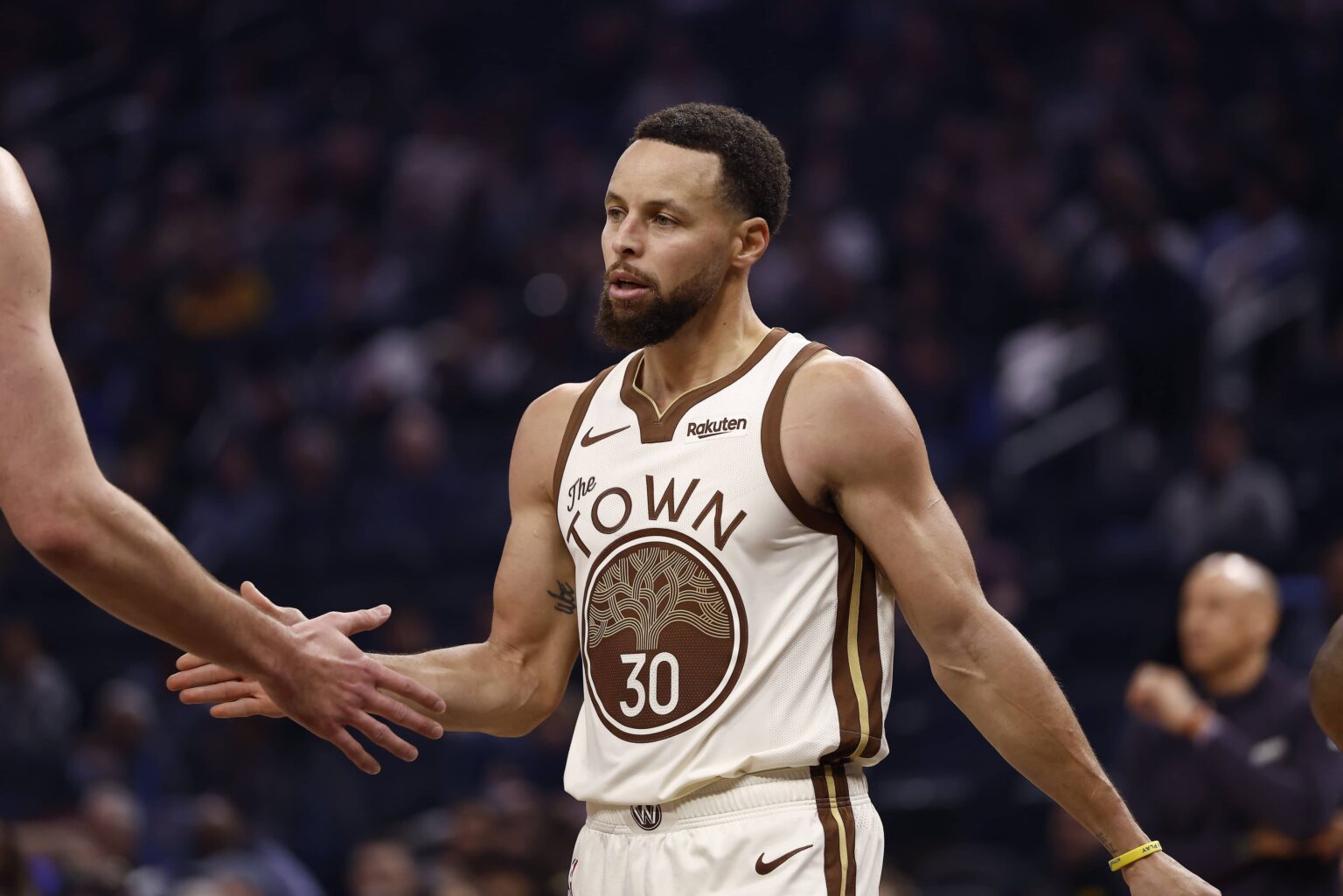 Jan 9, 2026; San Francisco, California, USA; Golden State Warriors guard Stephen Curry (30) high fives a teammate between plays against the Sacramento Kings during the first quarter at Chase Center. Mandatory Credit: Kelley L Cox-Imagn Images
